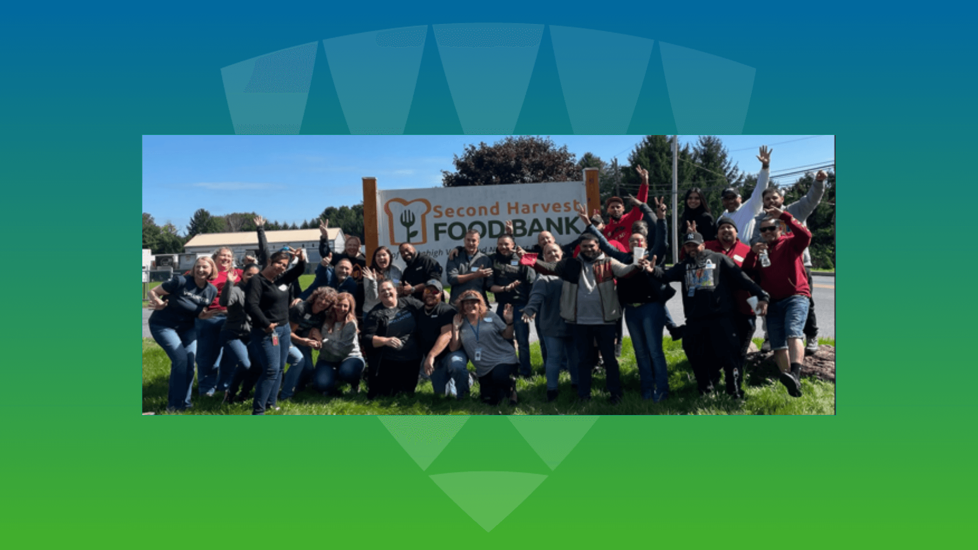A joyful group of Lineage team members posing outdoors at the Second Harvest Foodbank, celebrating their commitment to community service and team culture.