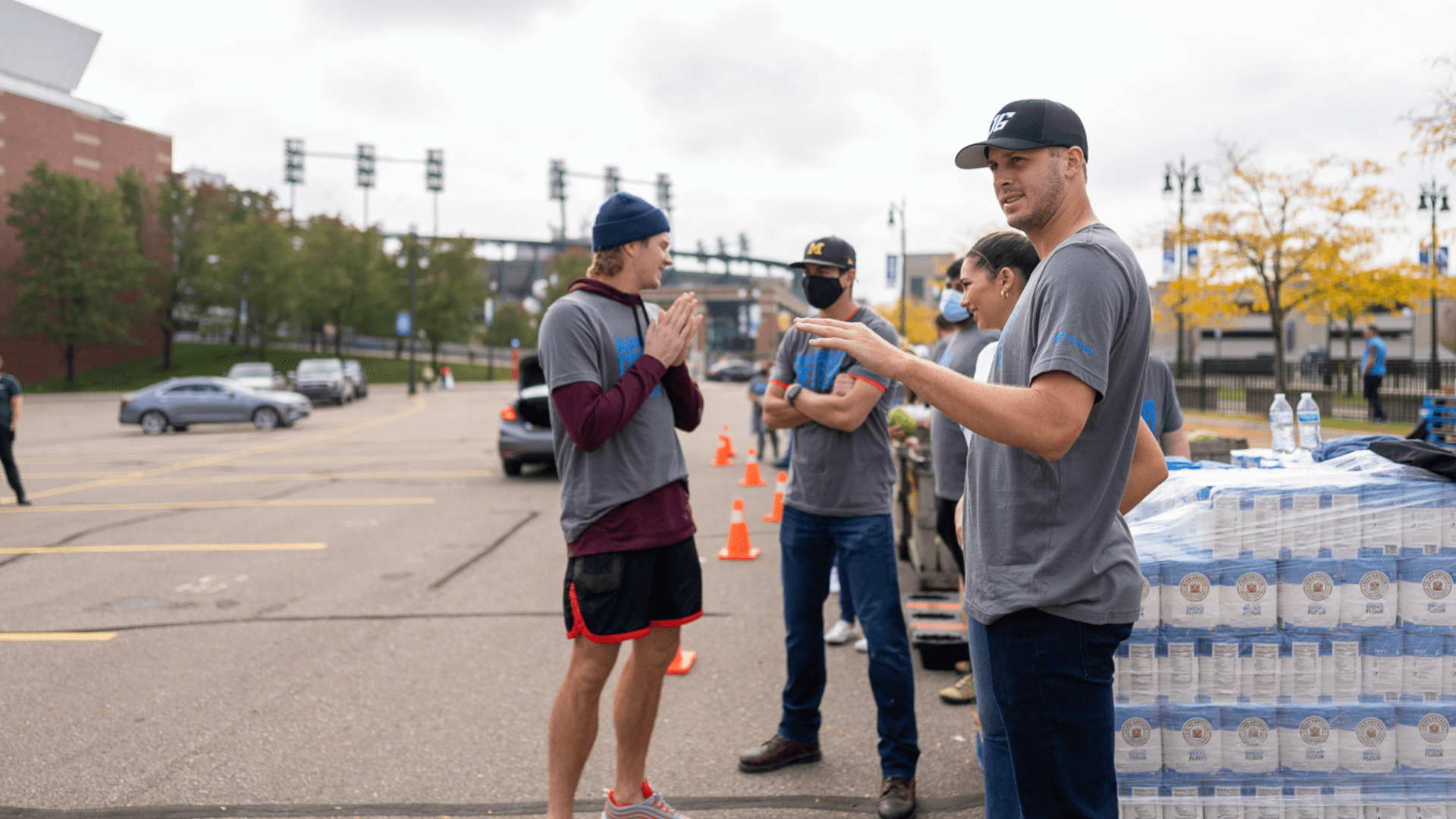 Detroit Lions quarterback Jared Goff with volunteers at Lineage Foundation for Good food insecurity event.