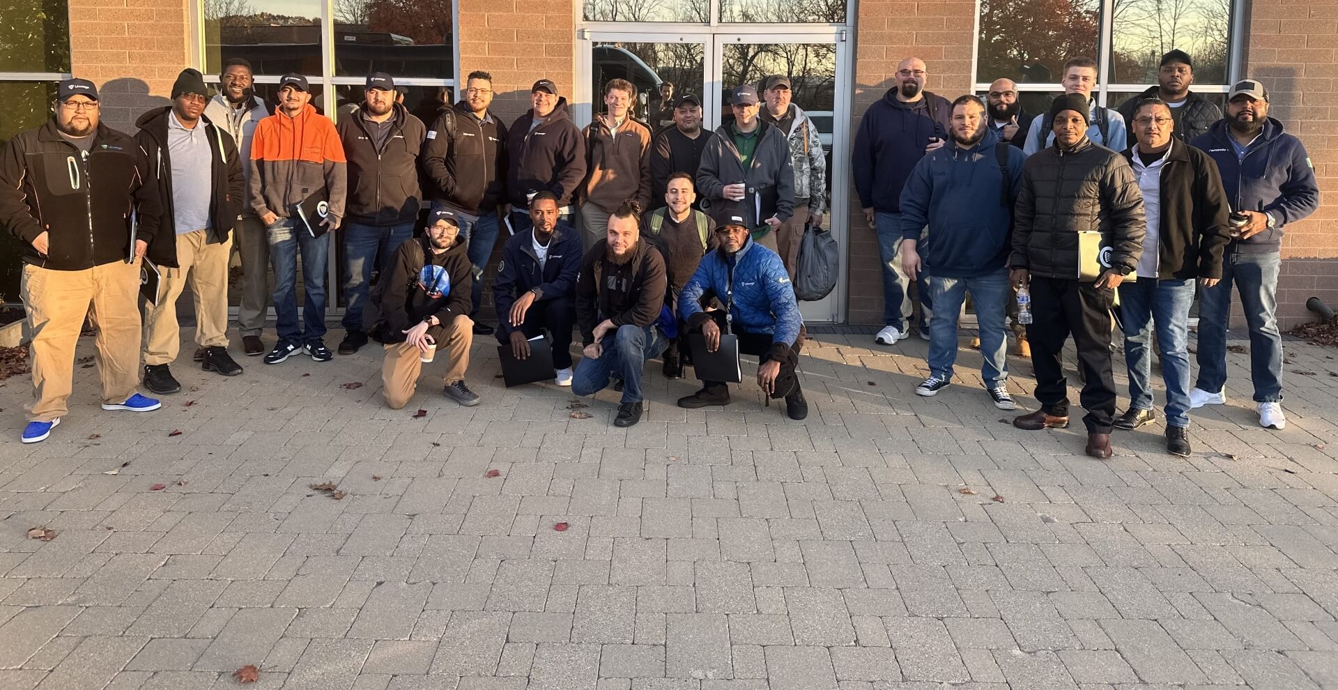 Group photo of Cohort 3 participants in the Lineage EDGE Program, gathered outdoors in front of a building, showcasing teamwork and leadership growth.