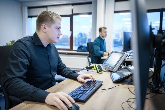 Customs brokerage team working at their desks