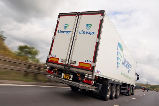 Lineage refrigerated truck transporting frozen food products along a highway, supporting temperature-controlled distribution and timely deliveries across the cold chain.