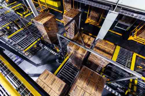 Pallets moving inside an automated Lineage cold storage warehouse