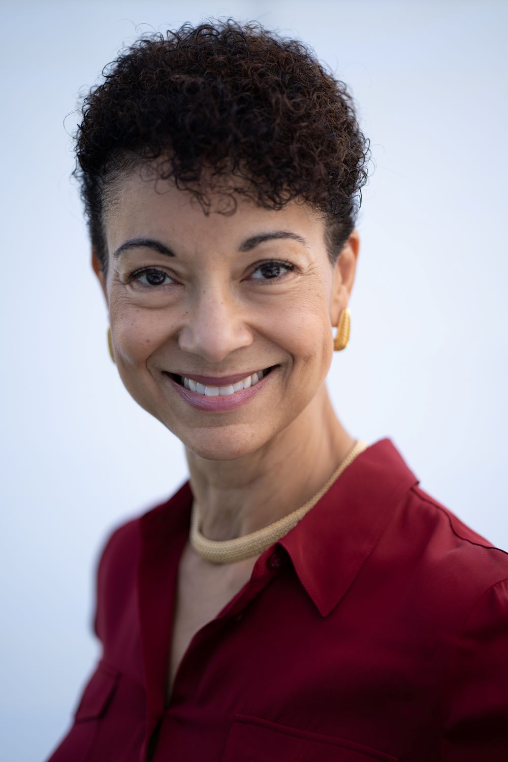 Headshot of Shellye Archambeau, new Lineage Board Member, wearing a red blouse and smiling, bringing over 30 years of technology leadership experience to the board.