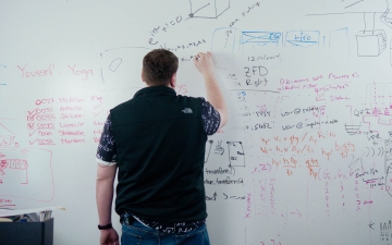 Man writing on whiteboard
