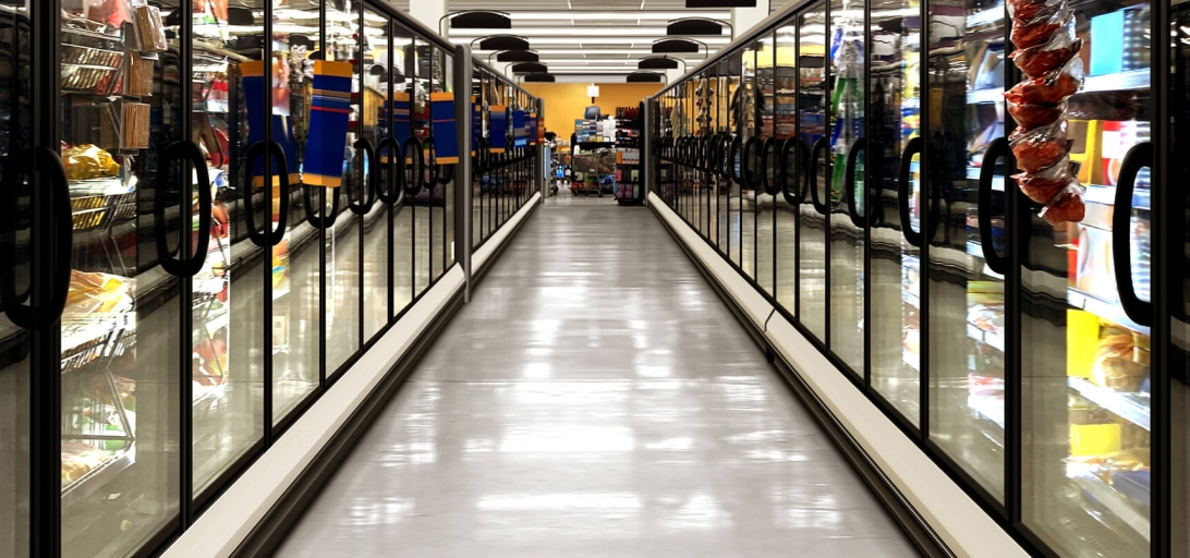 Frozen food aisle with cold storage cases, symbolizing efficient cross-border logistics.