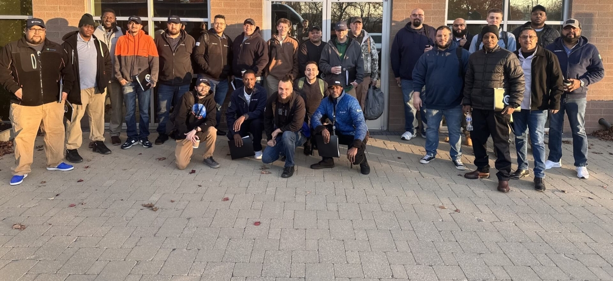 Group photo of Cohort 3 participants in the Lineage EDGE Program, gathered outdoors in front of a building, showcasing teamwork and leadership growth.
