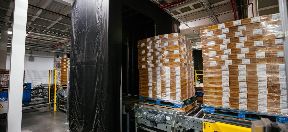 Pallets of products moving through the Lineage Eye system in a cold storage warehouse, using AI-powered computer vision to automate receiving and improve accuracy.