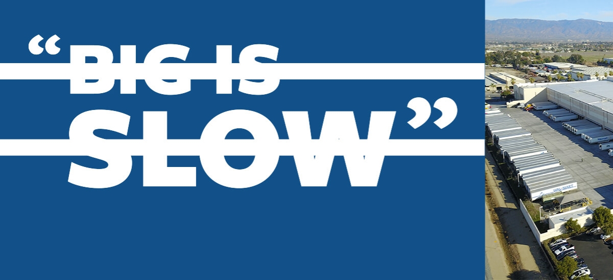 Aerial view of a large Lineage cold storage facility with rows of docked trailers, paired with bold blue text reading “Big is slow” crossed out, challenging the misconception.
