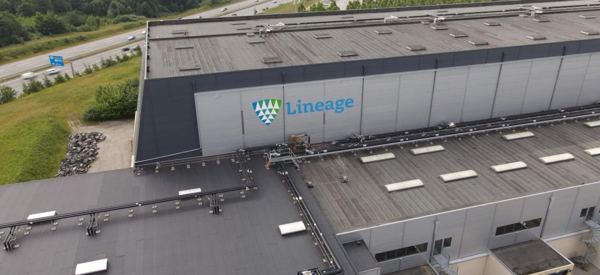 Aerial view of Lineage’s cold storage facility in Vejle, Denmark, showing loading docks and surrounding infrastructure.