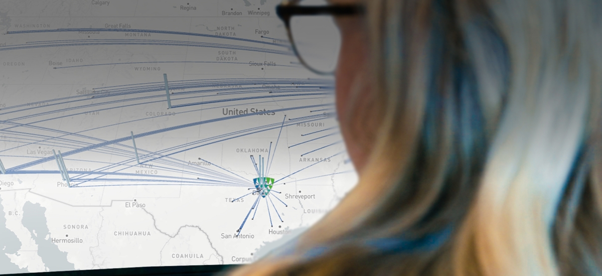 Lineage data scientist reviewing a U.S. supply chain network map with transportation routes visualized for optimization analysis.