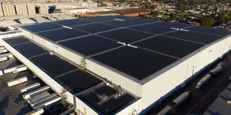 Wide-angle shot of Lineage’s Los Palos facility with loading docks and trailers on-site