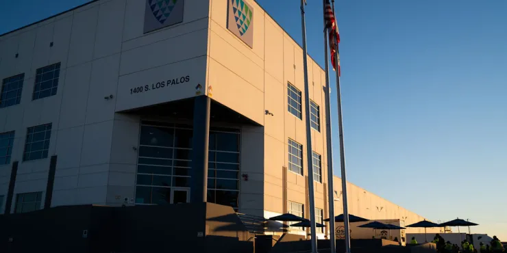 Front entrance of the Los Palos warehouse, highlighting signage and main access points