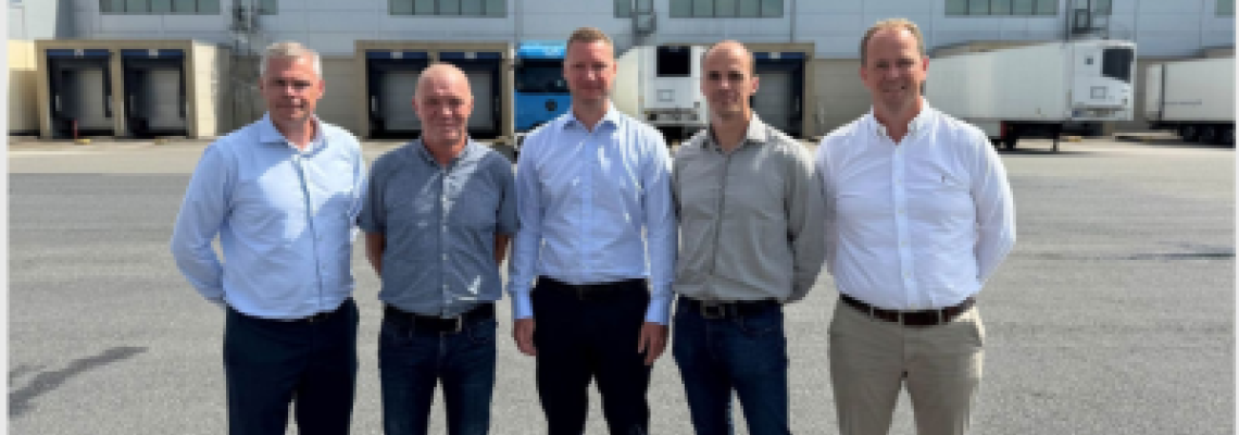 Danpo and Lineage leadership teams outside the Vejle cold storage facility in Denmark.