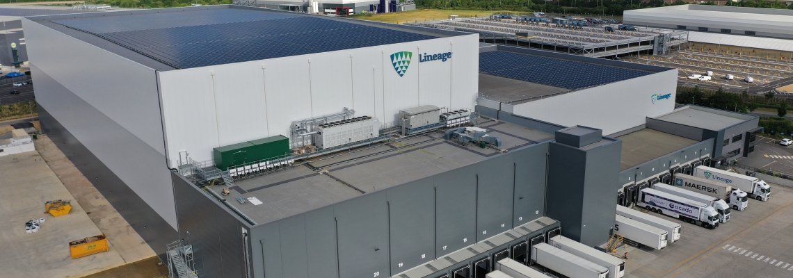 Lineage’s automated cold storage facility in Peterborough, UK, featuring solar panels and multiple loading bays for chilled and frozen distribution.
