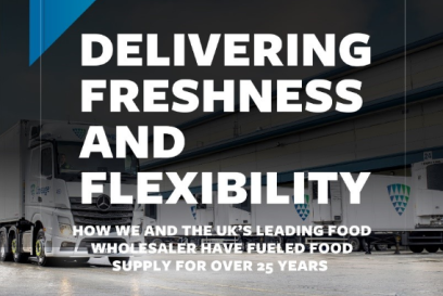Lineage refrigerated trucks at a UK food wholesaler distribution facility highlighting a 25-year temperature-controlled logistics partnership.