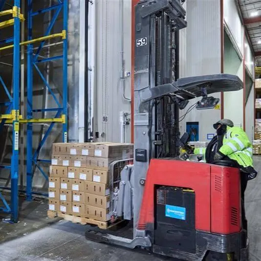 Lineage fork lift loading pallets of food into a warehouse for blast freezing serivices.