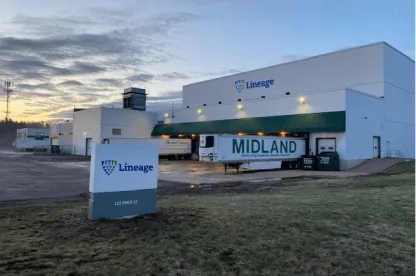Lineage's Moncton cold storage facility at 123 Price Street, New Brunswick, featuring the company’s signage, loading docks, and parked trailers under an early morning sky.