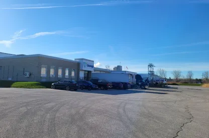 Exterior of Lineage London cold storage facility with loading docks and trucks